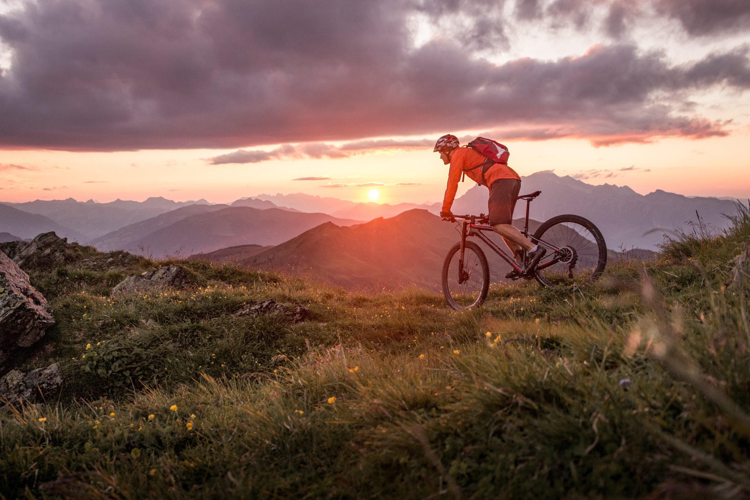 Male mountainbiker at sunset in the mountains